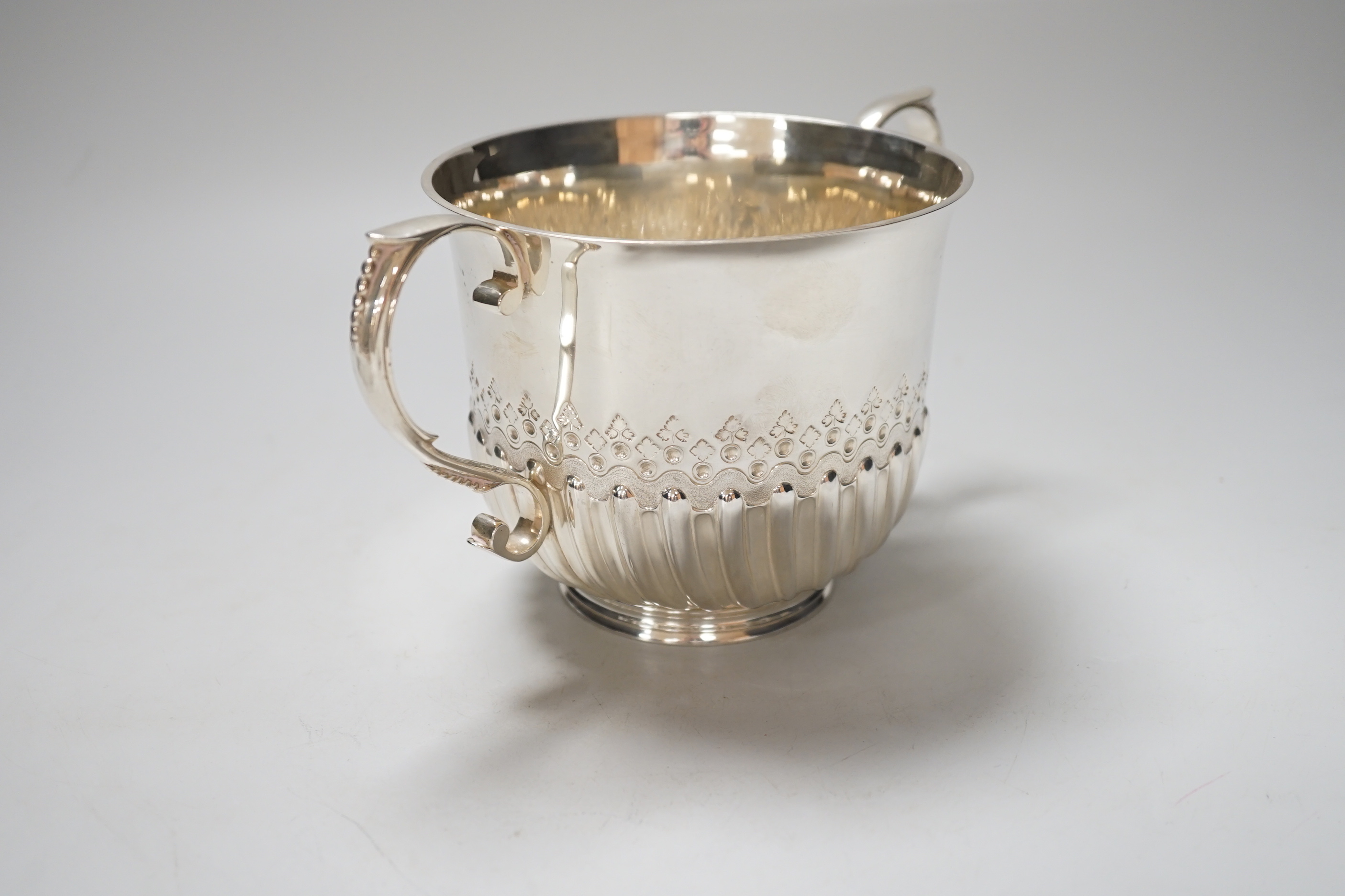 A Victorian silver loving cup, with scroll handles and demi-fluted body, London 1878, 21cm over the handles, 410 grams